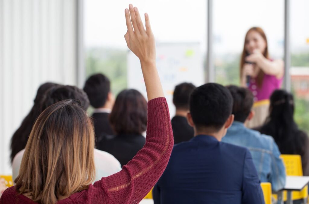 student raising hand